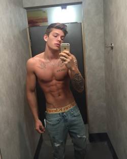 sagginboys:  Obligatory muscular guy with tats in fitting room