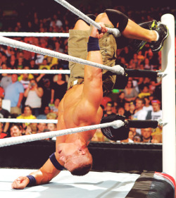 A wounded Cena struggling on the ropes…now is the time