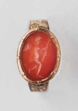 gemma-antiqua:  Ancient Roman intaglio depicting Cupid holding