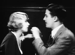  Ray Milland removes something from Joan Blondell’s eye in