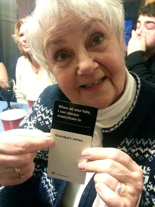 im-not-a-climbing-frame:   fight-0ff-yourdem0ns:  The kids face behind her is my reaction  Nothing brings families together at the holidays like Cards Against Humanity.   Love this game