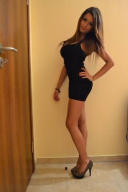 Hot tall brunette in little black dress & heels