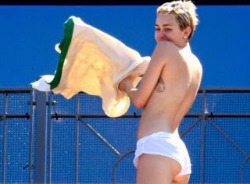 thewomanwatcher:  Miley Cyrus was caught sunbathing topless at