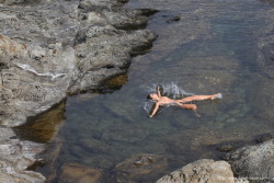 Yana splashes about the clear water at Cadaqués (Costa Brava,