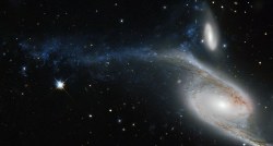  Meanwhile, 300 million light-years away, a huge galaxy in the