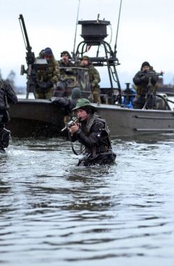 specialforcesnews:  A member of SEAL Team 5 covers his team mates