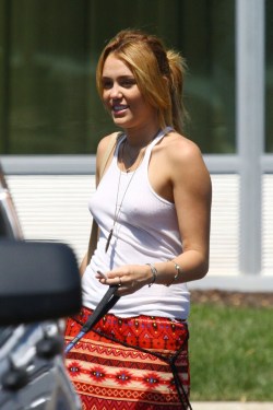 no-bra-celebrities:  Miley Cyrus pokies in see-through shirt