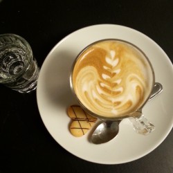 Small latte made with skim/whole milk.  (at Sofá Café)