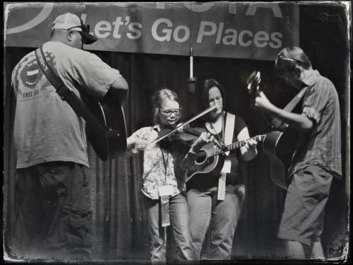 <p>And here’s happy place number two - backing up my students on stage - getting to hear them perform all the awesome tunes on which they’ve worked so hard. Plus I’ve got not one, but two Millers to help me remember the chords. #lifesavers #fiddle #weiser #gibsonguitars  (at National Oldtime Fiddlers’ Contest & Festival)</p>