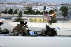 us-armedforces:  A USMC scout sniper keeps an eye out over the