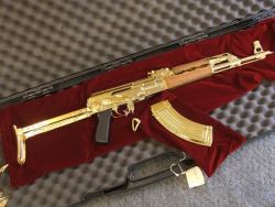 weaponslover:  The Saddam Special, a gold-plated Yugo underfolder.