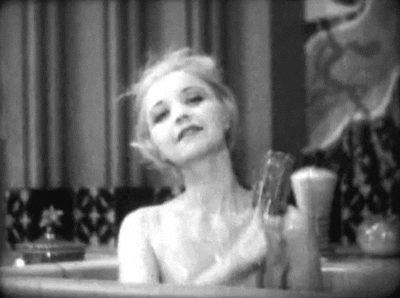 nitratediva: The adorable Alice White takes a bath in a department store window as a publicity stunt in Marshall Neilan's Sweethearts on Parade (1930).