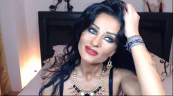 Gorgeous MILF wearing heavy make-up teasing on cam.http://www.bangmecam.com/en/chat/FoxyKarla69