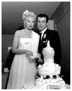 In Las Vegas, Lili St. Cyr cuts the wedding cake with husband