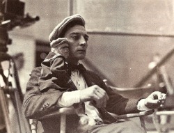 Buster Keaton with a pet monkey in a sailor suit.
