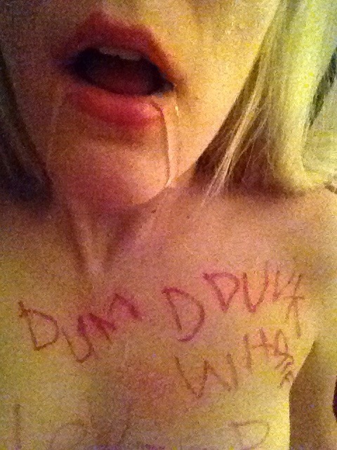 makemedum:  I had a couple requests to label myself a drunk whore and this is the best i could do b/c yea writing is hard even when im sober. Now im drunking vodka and finishing another joint! Getting dummer by the minute.  “Dumb Drunk Whore."Â