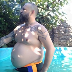 gordoom:  Fatso at pool 🐻🐷🚬 #shavedhead #muscleandgut