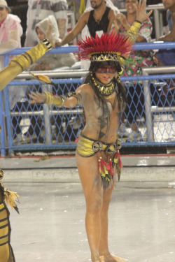 Topless at a Brazilian carnival, by Carlos Reis.