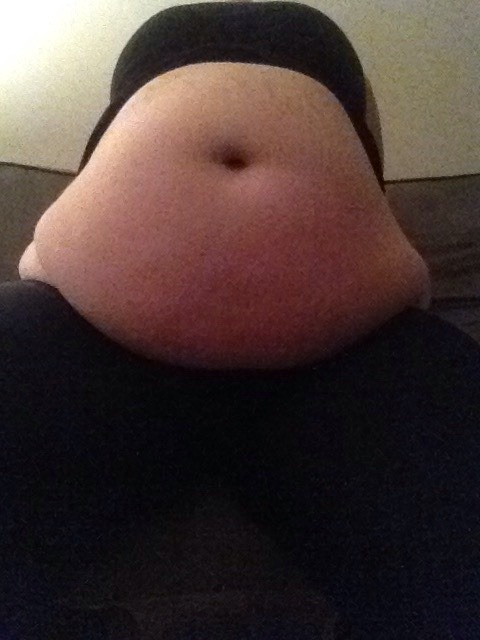 shinryuken3091: stuffedbellygirl18:  The most I can do without leaving the couch, my biggest shirts barely fit anymore!!  Gorgeous 