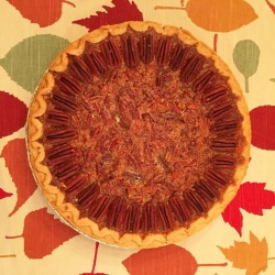 Happy Thanksgiving from me and the bourbon chocolate chip pecan pie I make every year!