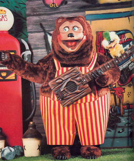 skeletonsiro:  With how spooky Weekend at Freddy’s is, I hope people are going back and looking at real life scary food mascots like the Showbiz Pizza Bear.  For extra creepiness, the kid’s shirt says “DICK THE BIRTHDAY BOY”  o.O