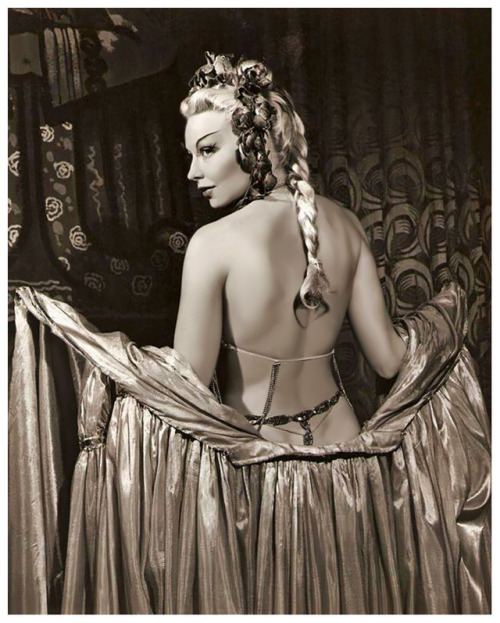 Lili St. Cyr        (aka. Marie Van Schaack)“In one of her early shows, she used a gold  Buddha placed on an altar inside a Chinese pavilion. To soft  Asian-inspired music, her movements told the story of a young bride  whose husband imprisoned