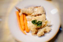 Braised rabbit in mushroom sauce with mashed potatoes and baby