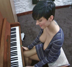Down shirt view big boobs girl playing organ