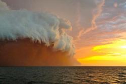 sixpenceee:  Dust storm off the coast of Onslow, Western Australia.