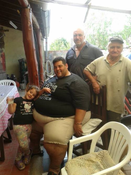 adiposexxxl:  Love it that he is sitting on two chairs  Mmm… Love how wide his thighs are.