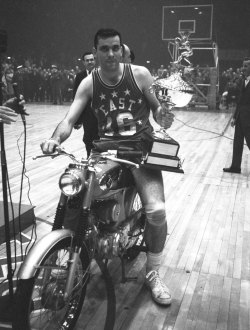 siphotos:  Jerry Lucas poses with the motorcycle and MVP trophy given