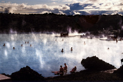 unrar:    Bathers swimming amidst the steam in the Blue Lagoon,