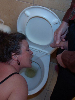 pissingonher:  Using the toilet 
