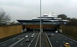 laughingsquid:  A Striking Photo of a Giant Yacht Passing Through