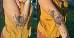 itscolossal:A Beetle Tattoo Spreads its Wings in Tandem With