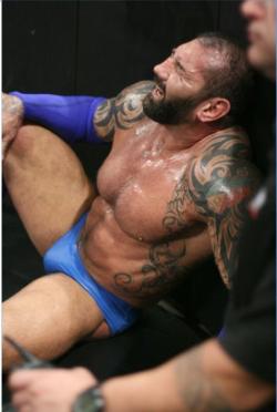 rwfan11:  ….nice shot of Batista in those infamous BLUE trunks!