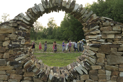 Throuhg the Moon Gate. Releasing the dreams performance ritual with the Diversity Dream Scroll with students, faculty and friends. Photo credit Gregory Wendt