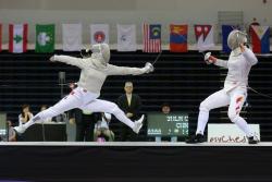 modernfencing:  [ID: a sabre fencer doing a leaping lunge at