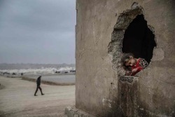 biladal-sham:  A girl is photographed in a damaged building at