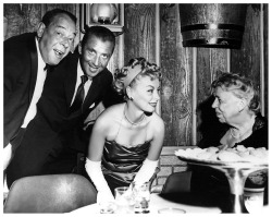 Vintage press photo dated from the mid-1950&rsquo;s features Lili St. Cyr welcoming former First Lady Eleanor Roosevelt to the &lsquo;El Rancho Vegas&rsquo; casino in Las Vegas.. Posing behind Lili are 'El Rancho&rsquo; owner Beldon Katleman and (at Far