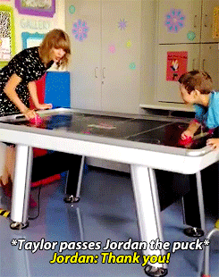 outofthewoods: Taylor plays air hockey with Jordan in the Boston