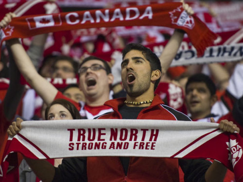 Singing our national anthem at … where else? A hockey game!