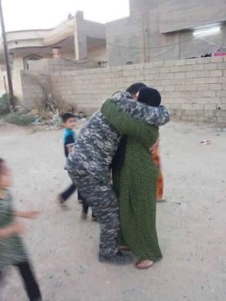 sixpenceee:  Iraqi police officer liberating his village from