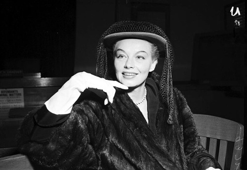 Lili St. Cyr Posing in her mink coat for Press photographers in an L.A. courtroom, at the start of her trial against Indecency charges.. In October of ‘51, vice squad officers arrested Lili during a performance at 'CIRO’s Nightclub’..