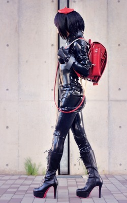 sutiblr:  Black rubber latex catsuit, black long boots, and with