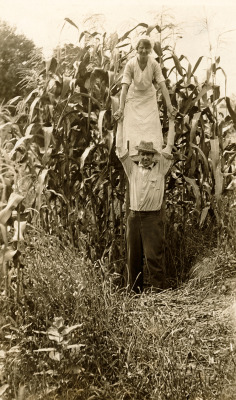 natgeofound:  A woman on a farmer’s shoulder emphasizes a corn
