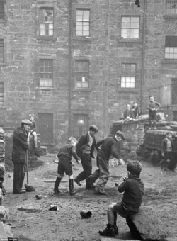 undr:Bert Hardy. Youngsters enjoy a kickabout in Glasgow in