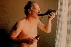 disregardinghenry:Werner Herzog drinks cough syrup from a shoe.