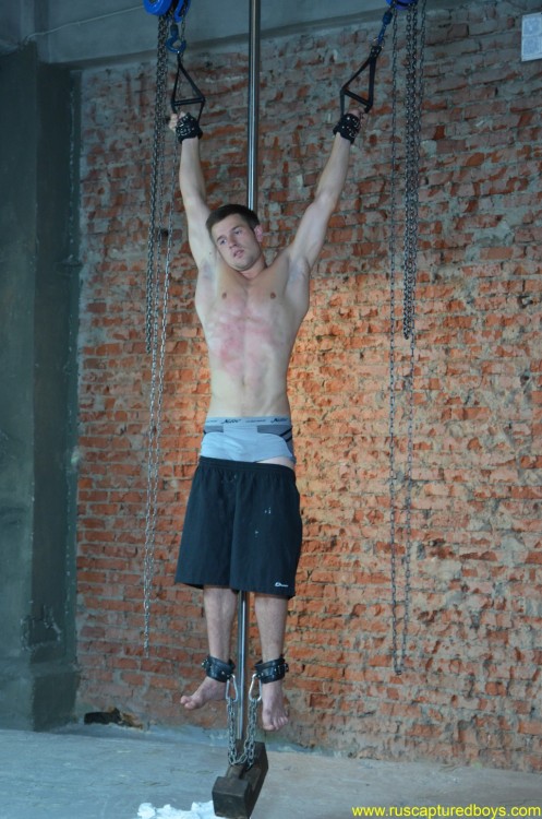 muscled stud suspended and flogged closeties1:  “Captured Worker” pt.1` 
