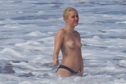 toplessbeachcelebs:  Miley Cyrus (Singer) swimming topless in